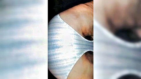 Mature BBW's huge tits squeezed in tight wet white striped swimsuit side boob view