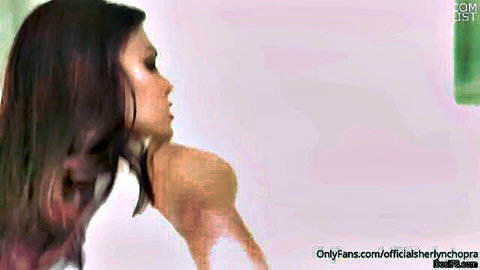 Nude curvy Indian MILF with big natural tits in seductive profile pose touching neck