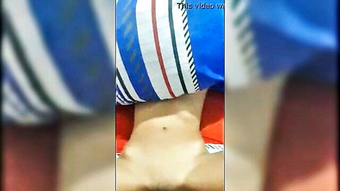 Amateur young guy lies naked on bed exposing his cock and balls close-up