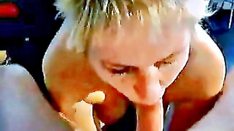Mature blonde milf sucks thick cock deep in mouth with hands on face closeup