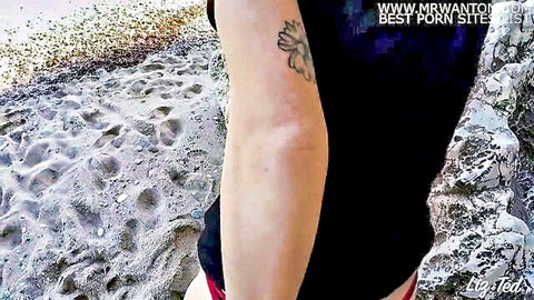 Tattooed babe in black top and red bikini on Sardinian beach, anal sex preview