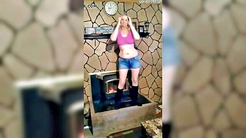 Blonde curvy wife in pink bra and low-rise jeans posing sexy at home