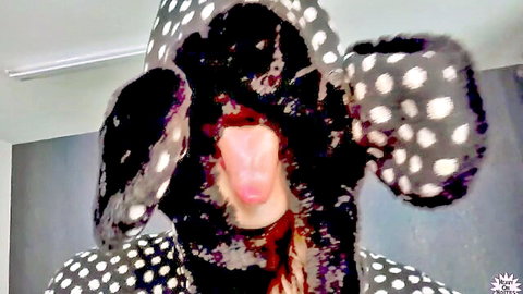 Liz Rainbow in dalmatian hood costume sticking tongue out playfully