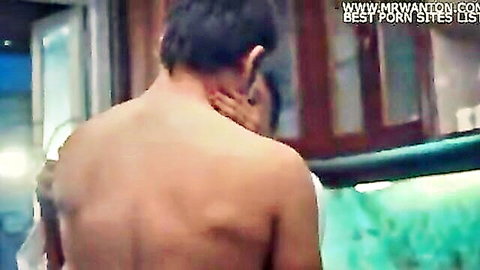 Indian couple in intimate embrace, shirtless man touched on neck by woman at home