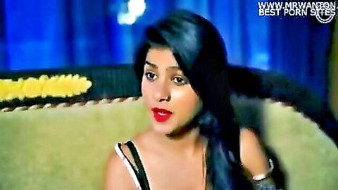 Sexy Indian babe with long black hair and red lips in strapless top, teasing pose