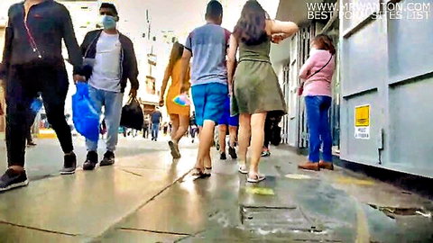 Amateur upskirt voyeur of women in dresses walking busy street