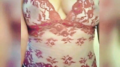 Sexy Latina in sheer red lace lingerie, deep cleavage tease