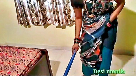 Desi Indian maid in colorful saree mopping bedroom floor with curves