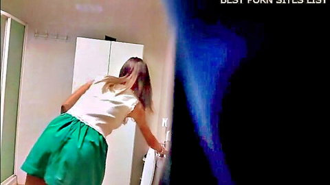 Hot secretary in green skirt bending over for quick pee in bathroom
