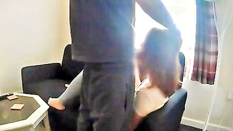 Amateur girlfriend giving blowjob on couch while calling customer service