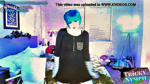 Blue-haired goth emo girl posing teasingly in striped black hoodie bedroom webcam
