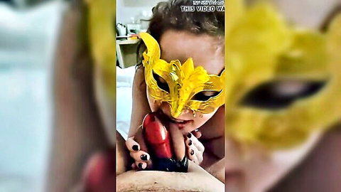 Masked woman teases with red dildo in cuckold chastity scene