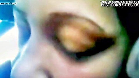 Close-up of seductive brown-eyed peasant woman in oral sex scene
