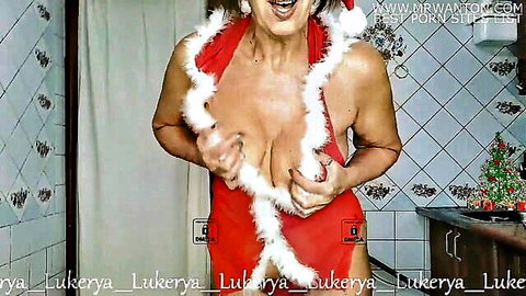 Lukerya in sexy red Santa lingerie, teasing with big cleavage for New Year's