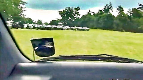 Rebekah Jordan and English blondes on road trip in countryside field with parked cars