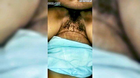 Indian bhabhi close-up of hairy pubic area under blue cloth, explicit tease