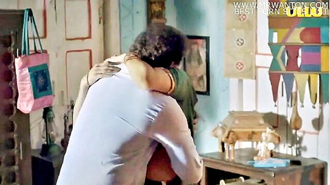 Indian couple in intimate back hug romance