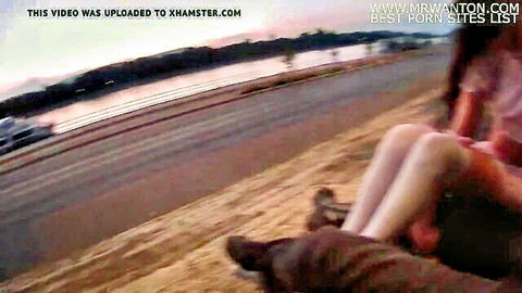Blurry outdoor public sex scene with woman in stockings by river