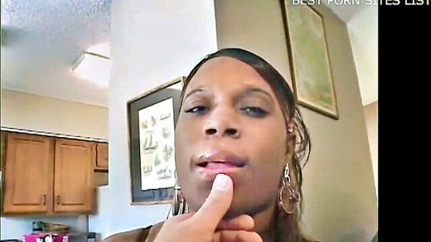 Mature black grandma with big tits and butt posing thoughtfully in kitchen