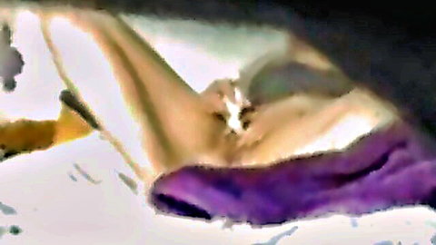Amateur wife masturbating to orgasm, legs spread on bed