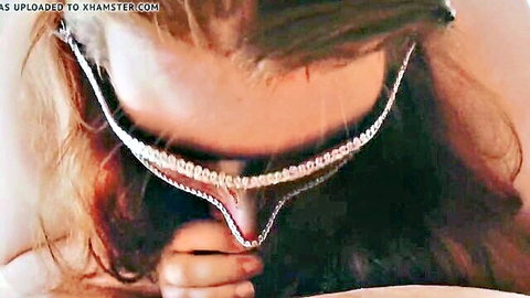 Brunette woman sucking hard cock with jeweled necklace choker
