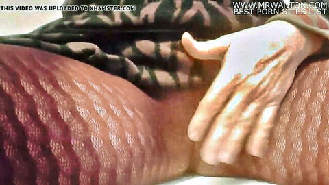 Ebony woman in patterned stockings with hand spreading her big ass cheeks