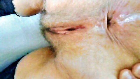 Close-up of spread hairy ass with visible anus and moisture