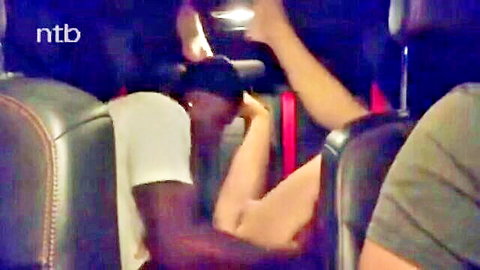 Black man in car with white woman arm action, cuckold vibe