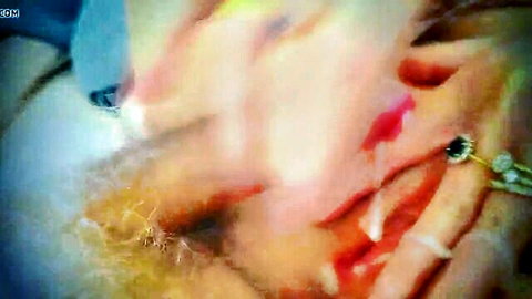 Close-up of woman's smeared red lips with cum dripping from mouth during messy blowjob cumshot