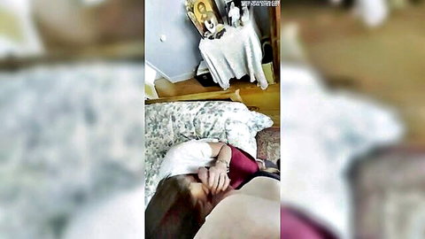 Catholic Odile in red dress on bed, seductive amateur pose