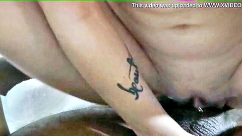 Tattooed woman with piercing straddling for vaginal penetration close-up