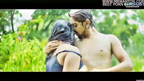 Shirtless hunk passionately kisses busty wet woman's neck outdoors groping her big natural tits