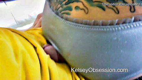Tattooed babe's tight ass fucked with pink cock head protruding from anus, gray panties aside.