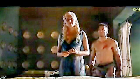 Lucy Lawless in revealing dress with muscular man in Spartacus sex scene