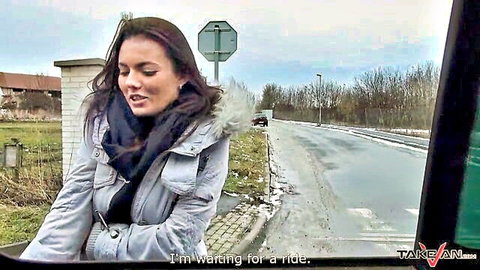 Brunette amateur waiting for ride in van, winter pickup scene