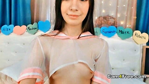 Skinny camgirl in sheer sailor top exposes perky tits on webcam