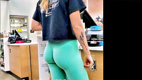 Sexy blonde in deep wedgie tight green leggings showing big ass from behind