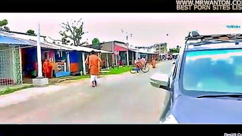 Indian women in orange robes walking rural village street in kissing porn setup