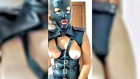 Latex masked babe exposes her perky tits in tight BDSM harness