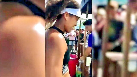 Naomi Osaka in sexy black sports bra and headband at beach event