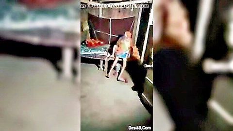 Blurry Desi Indian woman spreads legs showing hairy pussy fingered by man on outdoor bed