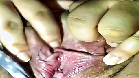 Close-up of wet Asian pussy spread open for sounding fetish view