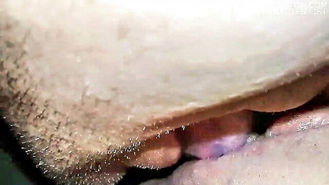 Bearded man licking white woman's shaved pussy in intense close-up cunnilingus