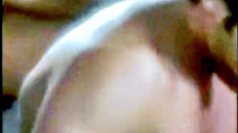 Blurry naked man back view in steamy FFFMMM barn orgy scene