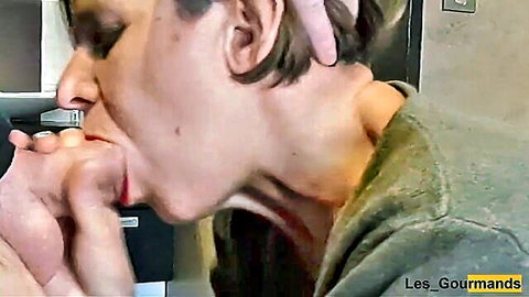 Woman with red lipstick performs intense blowjob and swallow close-up