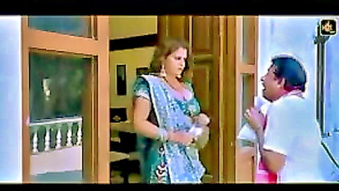 Busty Indian beauty in green saree flirting with older man at door