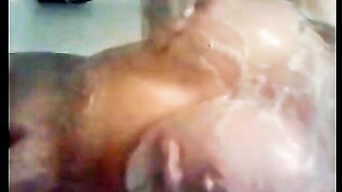 Blurry closeup of woman getting facial cumshot with thick semen dripping on her messy face and hair
