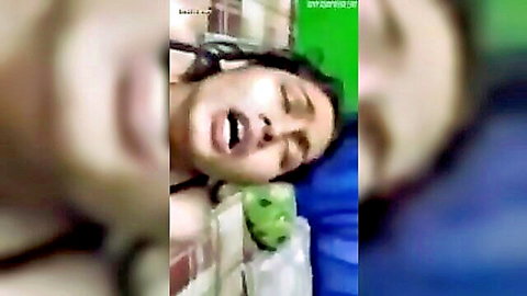 Desi Bhabhi close-up with open mouth in ecstasy, black top and blue bedding