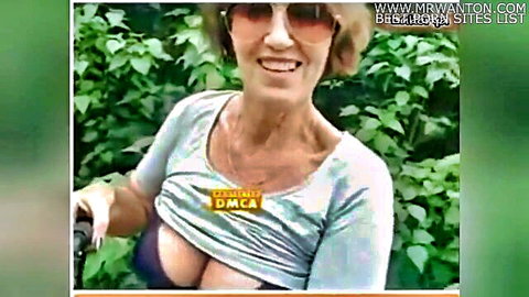 Mature housewife flashing big cleavage in forest outdoors
