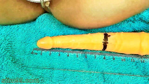 Japanese MILF close-up cervix penetration with large orange German dildo